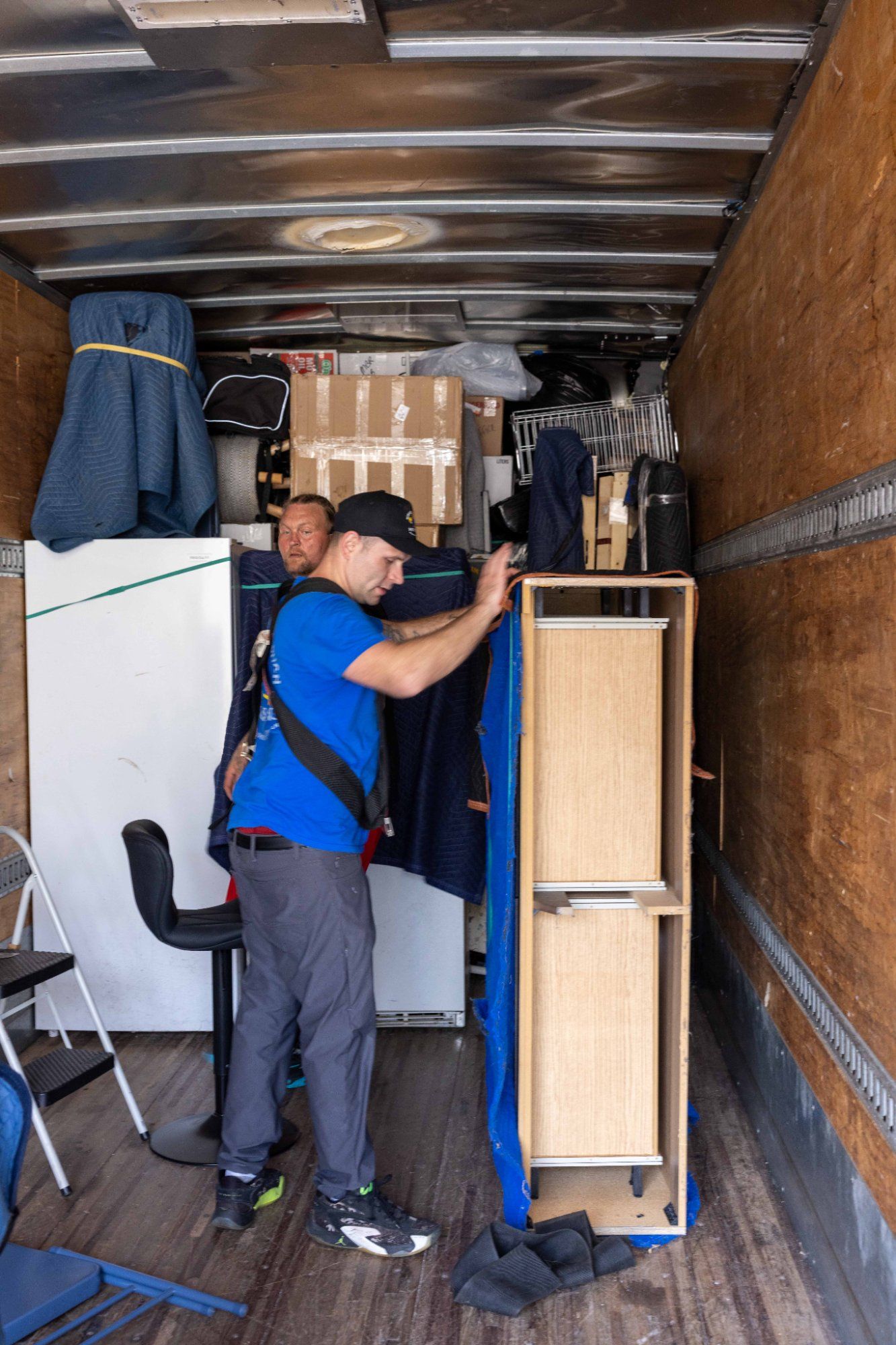 Midas Touch Moving crew organizing and packing items inside the truck during packing and unpacking services in Knoxville TN