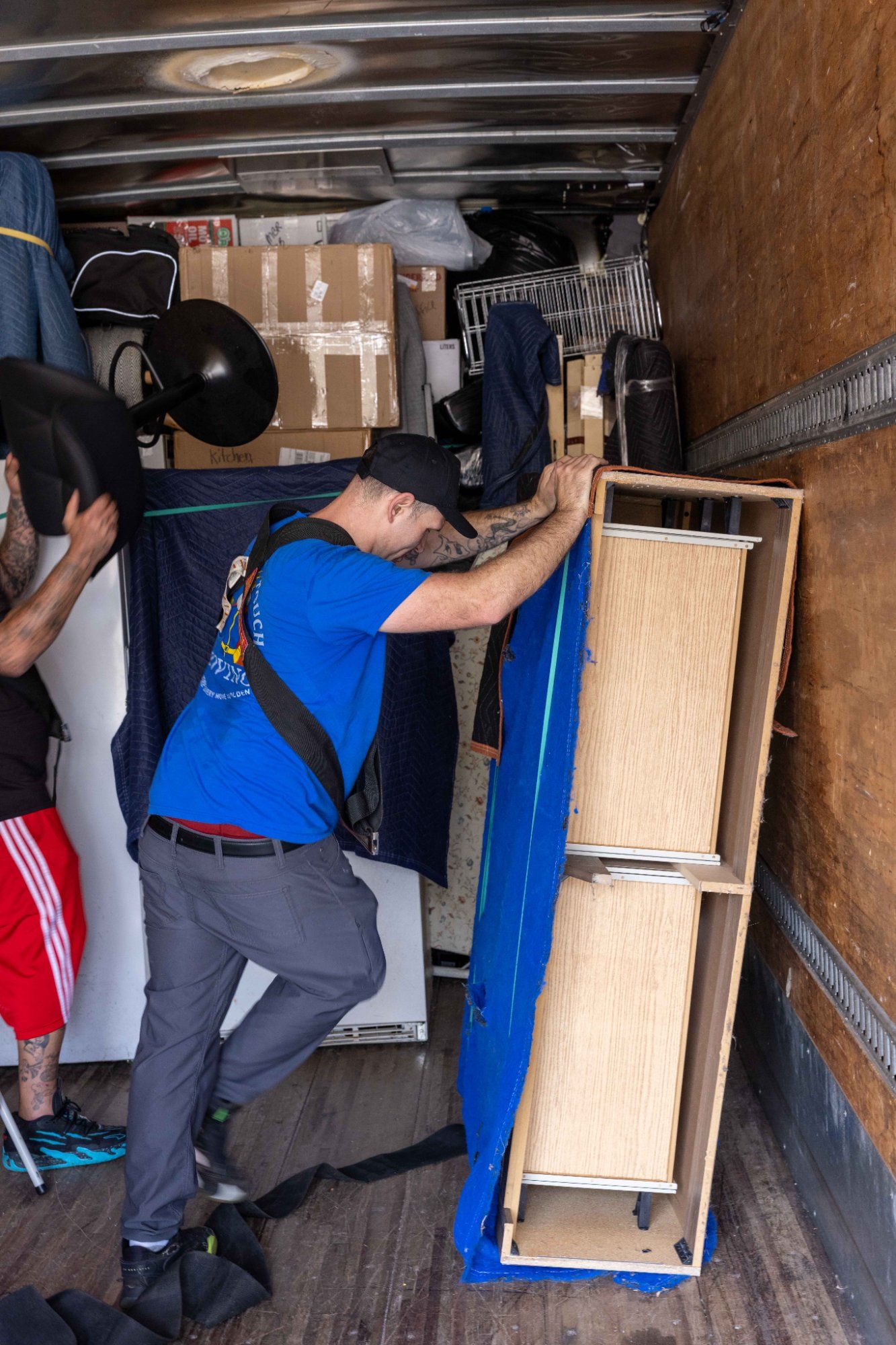 Midas Touch commercial movers securing office furniture with blankets and straps for a business relocation in Sevierville Tennessee