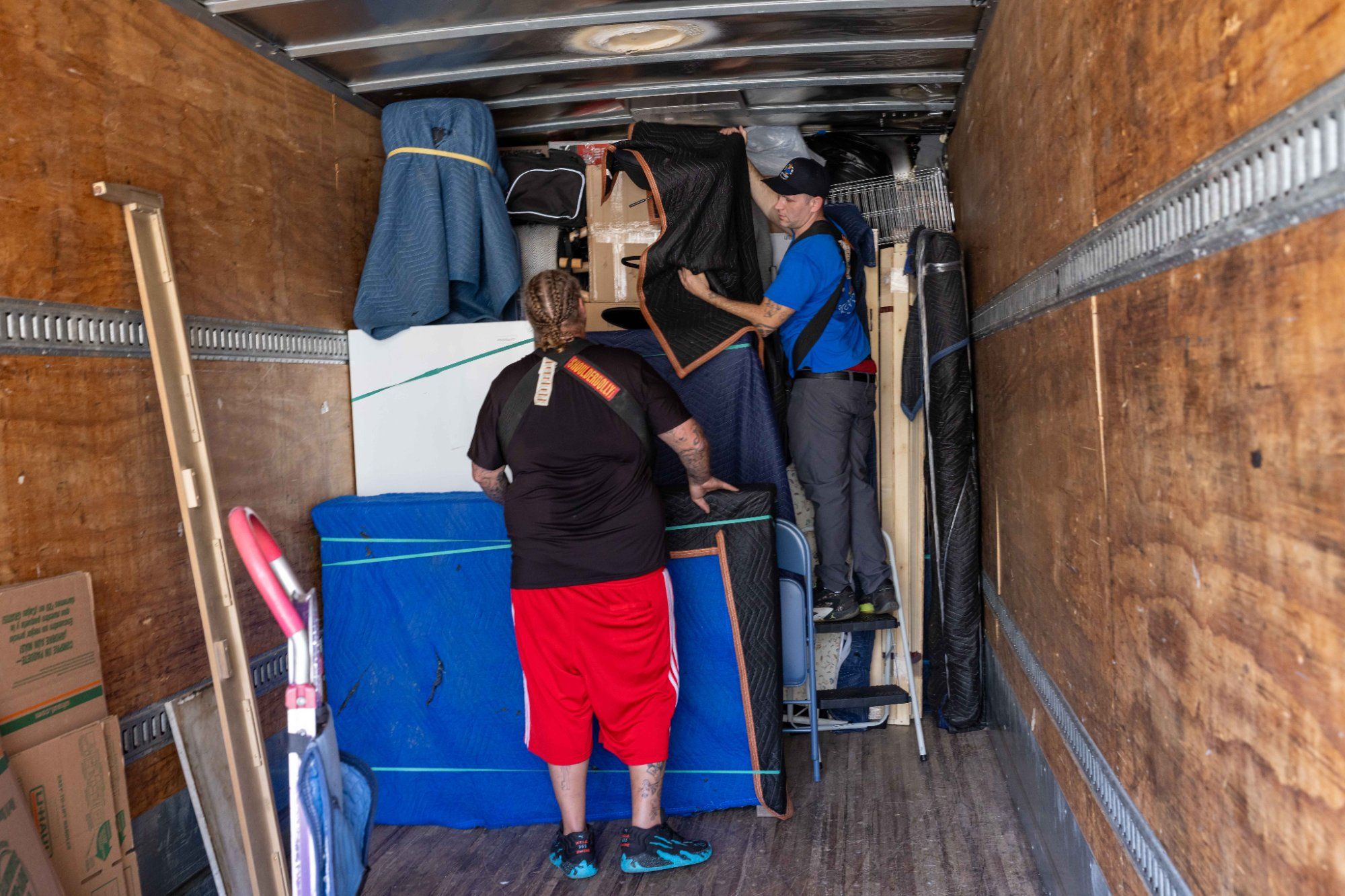Midas Touch mover using a hand truck dolly to transport packed boxes during packing services in Knoxville Tennessee