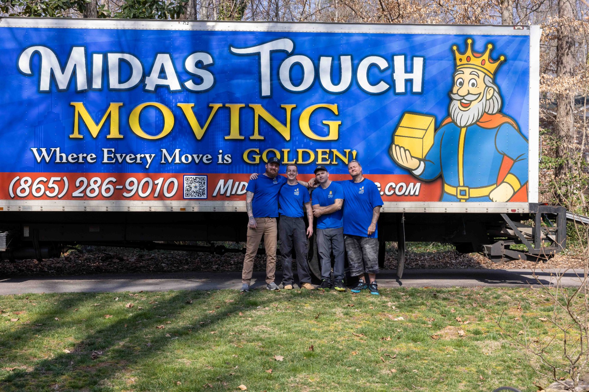 Midas Touch Moving team standing in front of the fully branded company truck in Sevierville TN