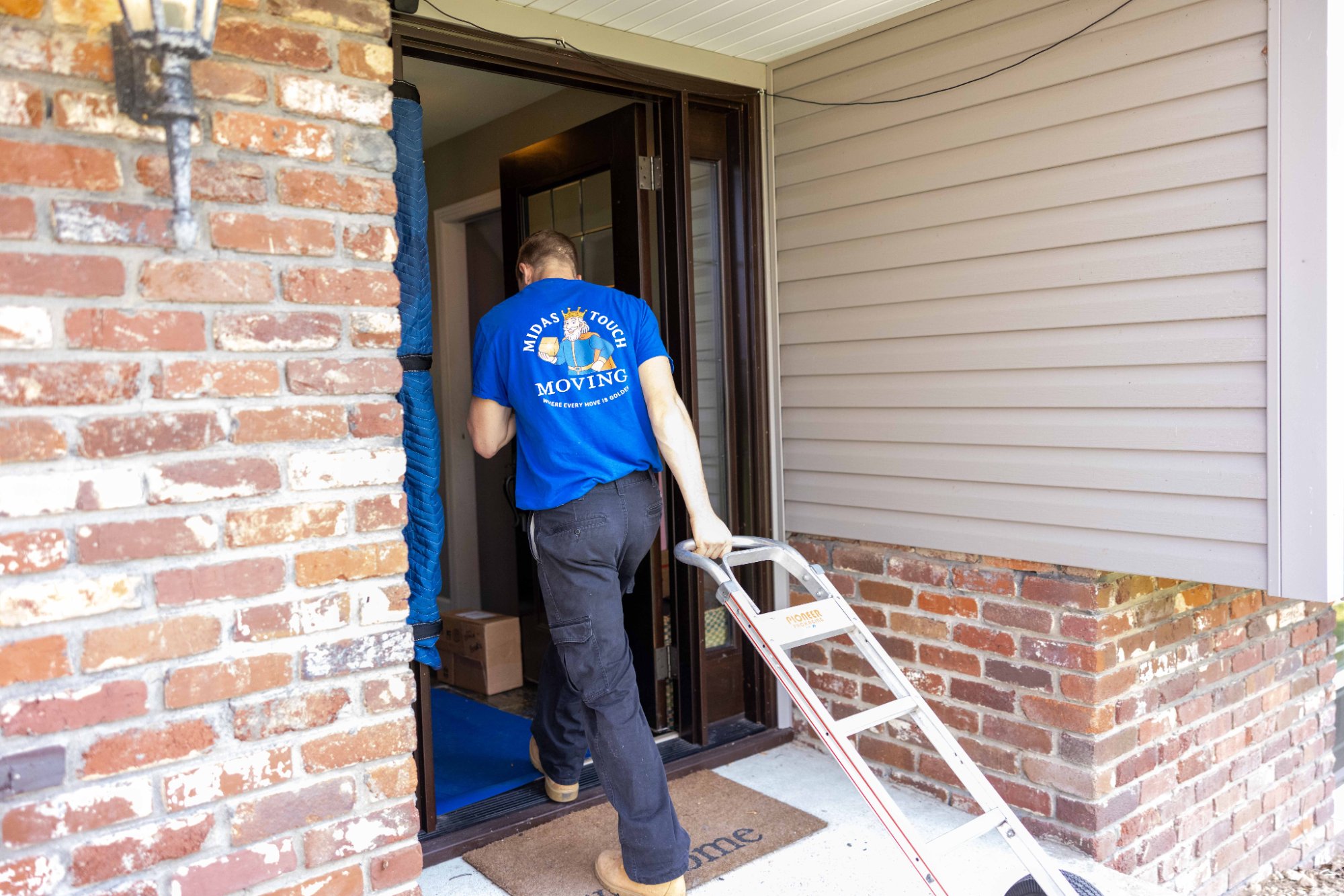 Midas Touch Moving crew member arriving at a Sevierville home front door with moving equipment